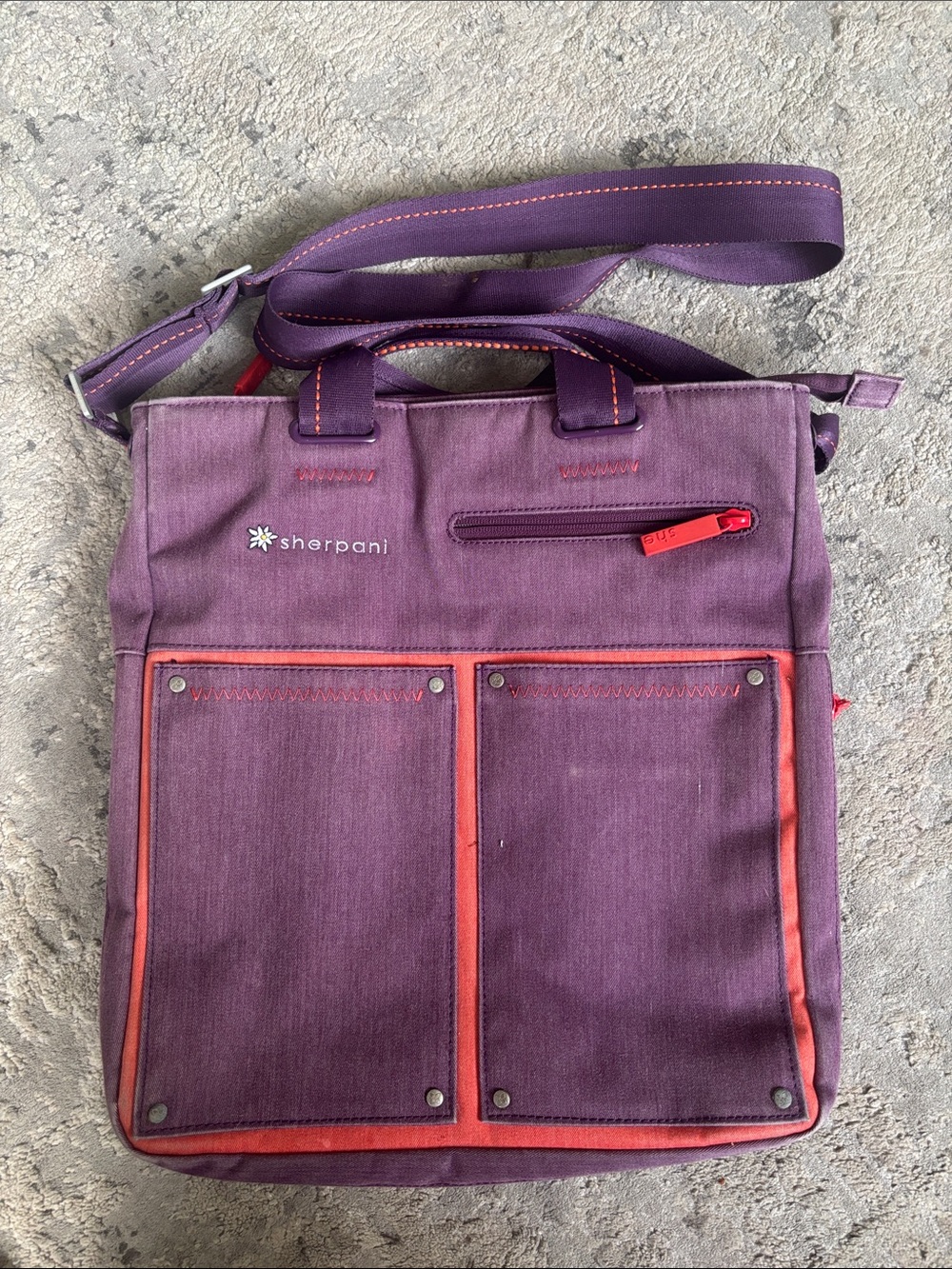 Sherpani purple messenger bag with red trim